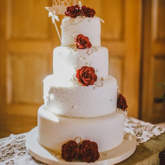 Picture of Gorgeous white anniversary cake with roses