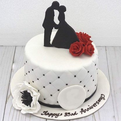 Picture of Gorgeous white anniversary cake with roses